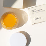 Ere Perez Papaya SOS Marmalade open jar with lid and boxes on a cream background