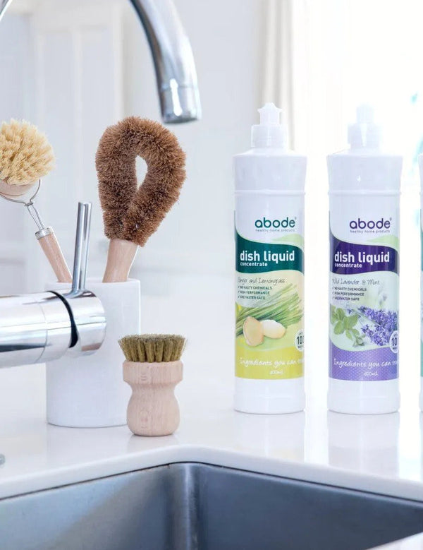 Abode Dishwashing Liquid Ginger and Lemongrass beside a kitchen sink