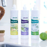 Abode Dishwashing Liquid Lime Spritz beside a kitchen sink