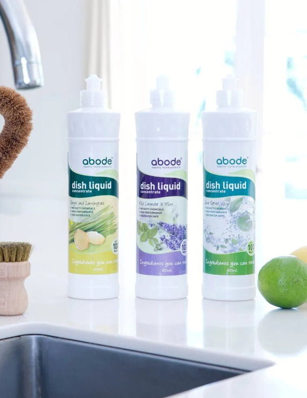 Abode Dishwashing Liquid Lime Spritz beside a kitchen sink