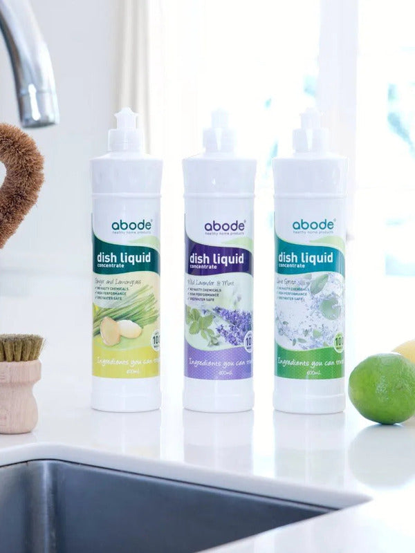 Abode Dishwashing Liquid Lime Spritz beside a kitchen sink