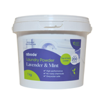 Abode Lavender & Mint Laundry Powder 1 kg in a white round tub with a snap-on lid and purple and lime green label, shown from the front on white.
