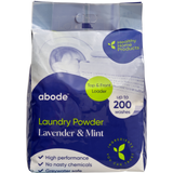 Abode Lavender & Mint Laundry Powder 4 kg refill bag, shown from the front on white. The purple and lime green and white pack is labelled for top and front loaders.