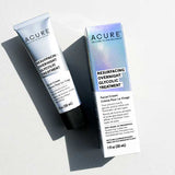 A tube and box of Acure Resurfacing Overnight Glycolic Treatment are displayed on a white surface with shadows, emphasizing its sleek white packaging with blue accents—ideal for gentle exfoliation and radiant skin.