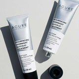 Two tubes of Acure Resurfacing Overnight Glycolic Treatment are displayed on a white surface, one with its black cap off—ideal for gentle exfoliation and helping you achieve radiant skin.