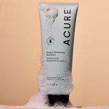 ACURE Simply Smoothing Shampoo styled with airy cleansing foam
