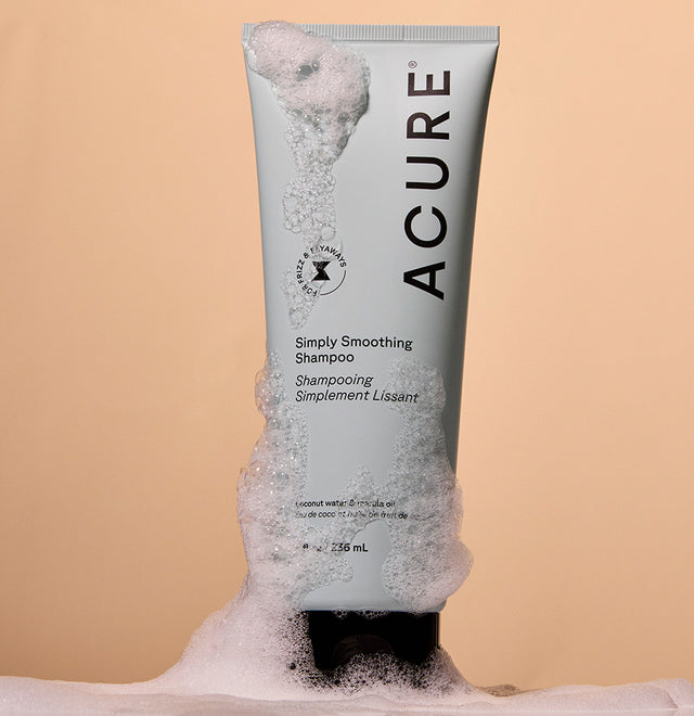 ACURE Simply Smoothing Shampoo styled with airy cleansing foam