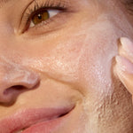 Close-up of ACURE Seriously Soothing Cleansing Cream applied to the face