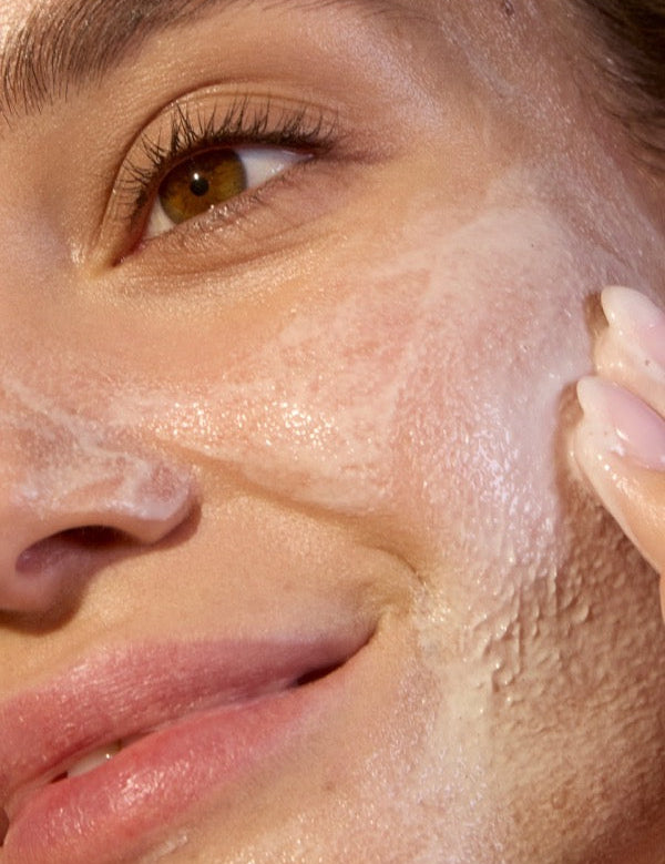 Close-up of ACURE Seriously Soothing Cleansing Cream applied to the face