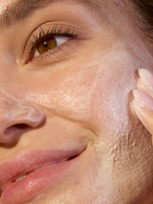 Close-up of ACURE Seriously Soothing Cleansing Cream applied to the face