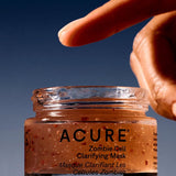 Hand using Acure Zombie Cell Clarifying Mask