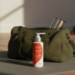 Amazing You Joint Magnesium Lotion beside a gym bag