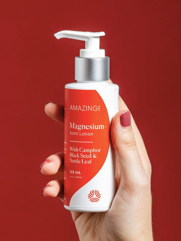 Amazing You Joint Magnesium Lotion held in hand