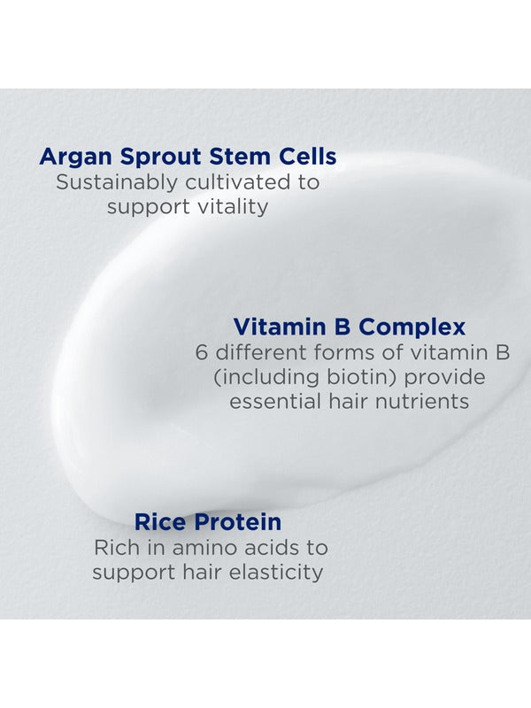 A white cream smear behind three Andalou Argan Stem Cell ingredient callouts: sustainably cultivated argan sprout stem cells for vitality; six forms of vitamin B, including biotin, for hair nutrients; and amino-acid-rich rice protein for hair elasticity.