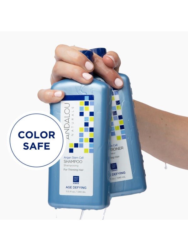 Andalou Argan Stem Cell Shampoo held in hand