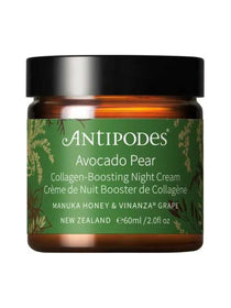 Antipodes Avocado Pear Night Cream in an amber glass jar with a green label, gold botanical details and a wide, smooth black lid, on white.