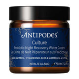 Antipodes Culture Probiotic Night Recovery Water Cream in an amber glass jar with a navy blue botanical label, white lettering and a wide black lid.