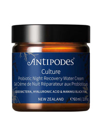 Antipodes Culture Probiotic Night Recovery Water Cream in an amber glass jar with a navy blue botanical label, white lettering and a wide black lid.