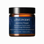 The Antipodes Jasmine Flower Menopause Facial Cream 60ml comes in a brown jar with a dark lid and blue label, is dermatologically approved for sensitive skin, and features hyaluronic acid for enhanced hydration.
