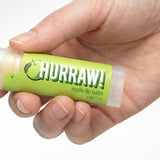 Hand holding Hurraw! Organic Lip Balm - Apple 4.8g