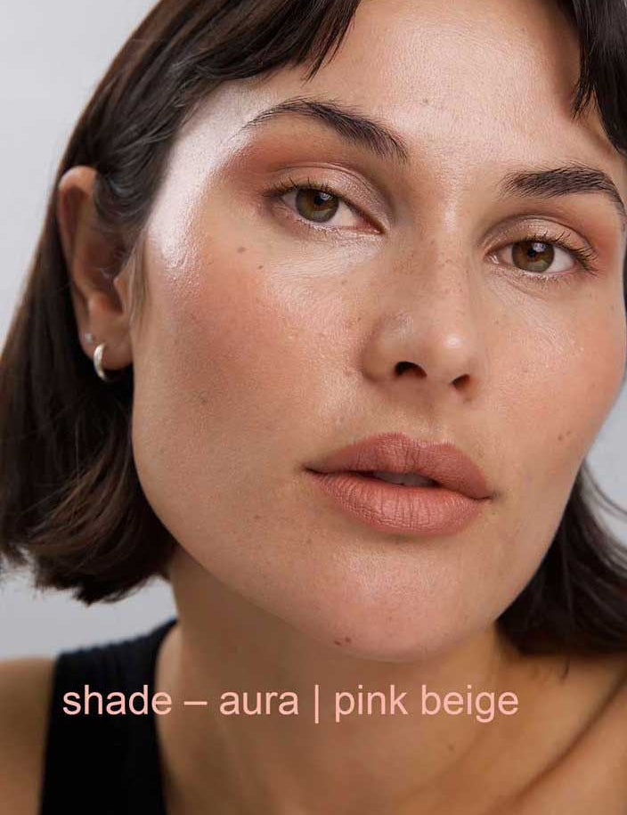 Close-up of a person wearing pink beige makeup with 'shade - aura | pink beige' text.