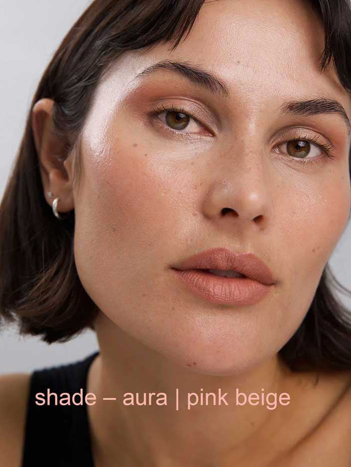 Close-up of a person wearing pink beige makeup with 'shade - aura | pink beige' text.