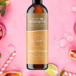 Australian Biologika Citrus Rose Conditioner — citrus rose conditioner styled with fruit