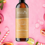Australian Biologika Citrus Rose Conditioner — citrus rose conditioner styled with fruit