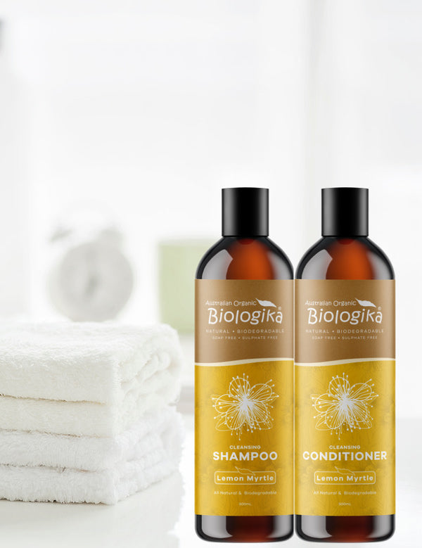 Australian Biologika Lemon Myrtle Shampoo — lemon myrtle shampoo and conditioner in a bathroom setting
