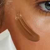 Close-up model wearing Avocado Zinc SPF 50 Natural Tinted Moisturiser