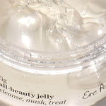Close-up of the clear jelly texture inside the open Ere Perez Fig All-Beauty Jelly jar