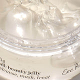 Close-up of the clear jelly texture inside the open Ere Perez Fig All-Beauty Jelly jar