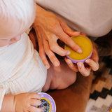 Parent using Badger Night-Night Balm with a child