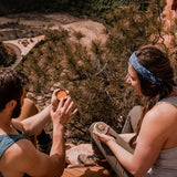 Hikers using Badger Sore Muscle Rub outdoors