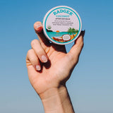 Badger Coconut After Sun Balm held at the beach