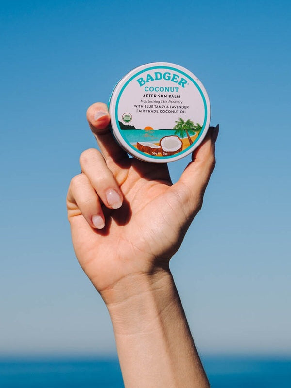 Badger Coconut After Sun Balm held at the beach