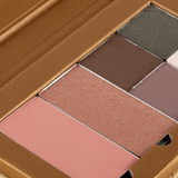 A close-up of Benecos Beauty ID Palette Blush Refills, featuring several talc-free blush and eyeshadow shades in neutral and pink tones, all packaged in a cardboard case.