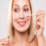 Model applying Benecos Concealer under the eye