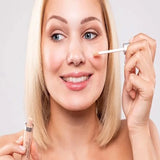 Model applying Benecos Concealer under the eye