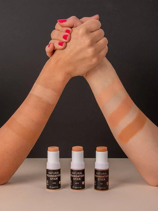 Foundation Stick shade swatches across two forearms with three Benecos Natural Foundation Stick bottles below.