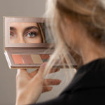 Model holding a Benecos Beauty ID Palette