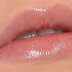Close-up of lips wearing a glossy nude shade of Benecos Natural Lipgloss.