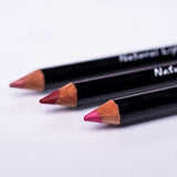 Benecos Natural Lipliner pencils in nude, red and bright pink arranged diagonally on a pale background.