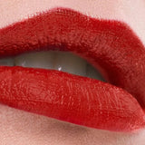 Close-up of lips wearing a rich red shade of Benecos MAT Lipstick.