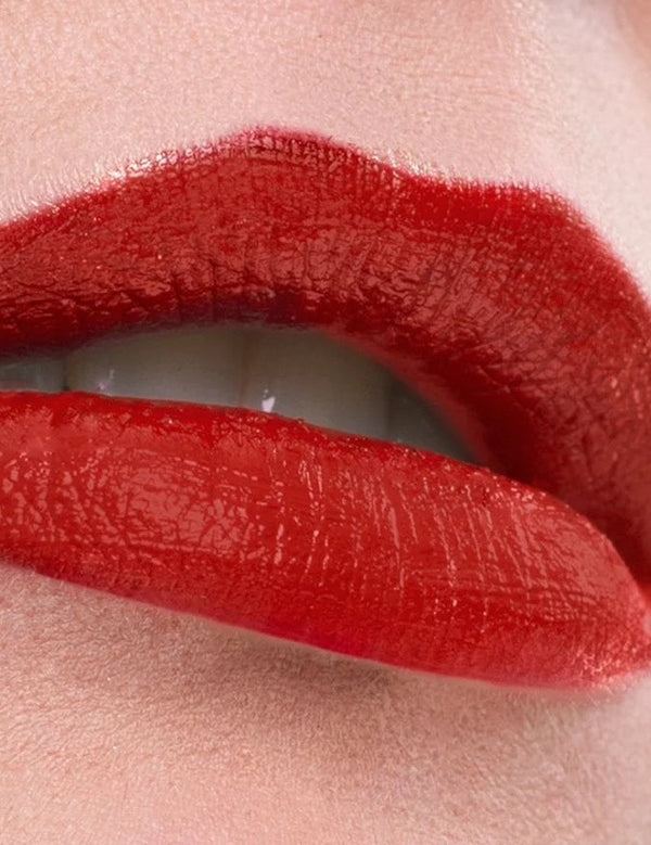 Close-up of lips wearing a rich red shade of Benecos MAT Lipstick.