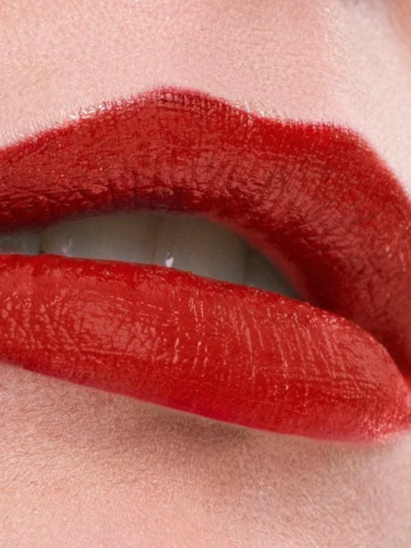 Close-up of lips wearing a rich red shade of Benecos MAT Lipstick.