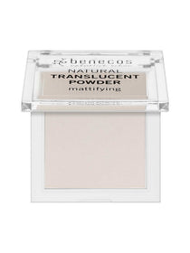 Open square Benecos Mission Invisible powder compact with a pale pressed powder pan and a raised clear lid printed with black lettering.