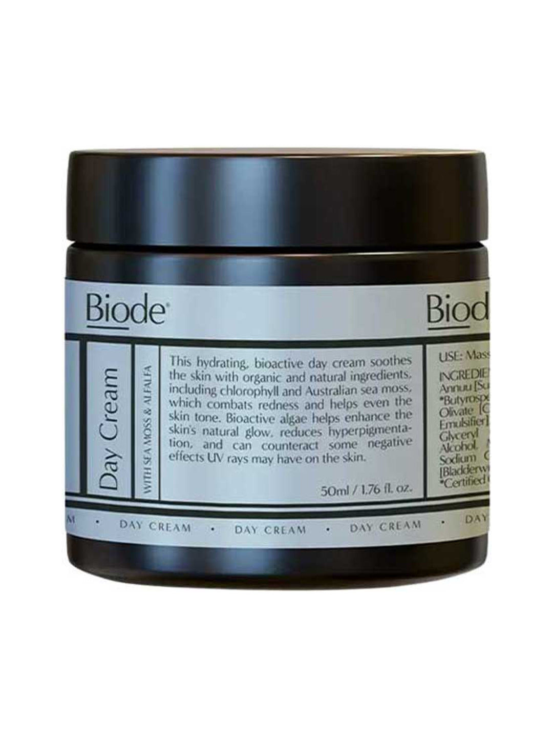 Dark amber Biode Day Cream jar with a wide black screw lid and a pale blue-grey label divided into panels of black text.