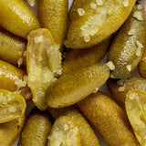 Close-up of sliced Australian finger limes with translucent yellow-green pearls, the botanical ingredient featured in Biologi Bf Restore Face & Body Serum.