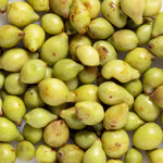 Close-up of green and yellow Kakadu plums, the botanical source featured in Biologi Bk Vitamin C Face & Eye Serum.